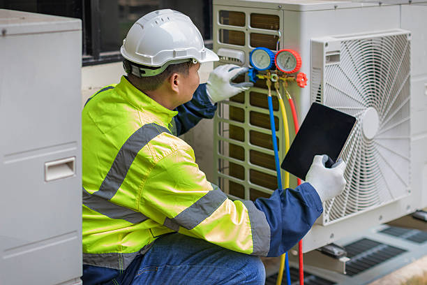 Professional Heat Pump Repair technician working in Alcove, NY